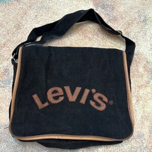Levi’s black w/brown crossbody/laptop bag, sticky closure & adjustable strap